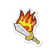 Retro Distressed Sticker Of A Cartoon Flaming Sword Stock Photo