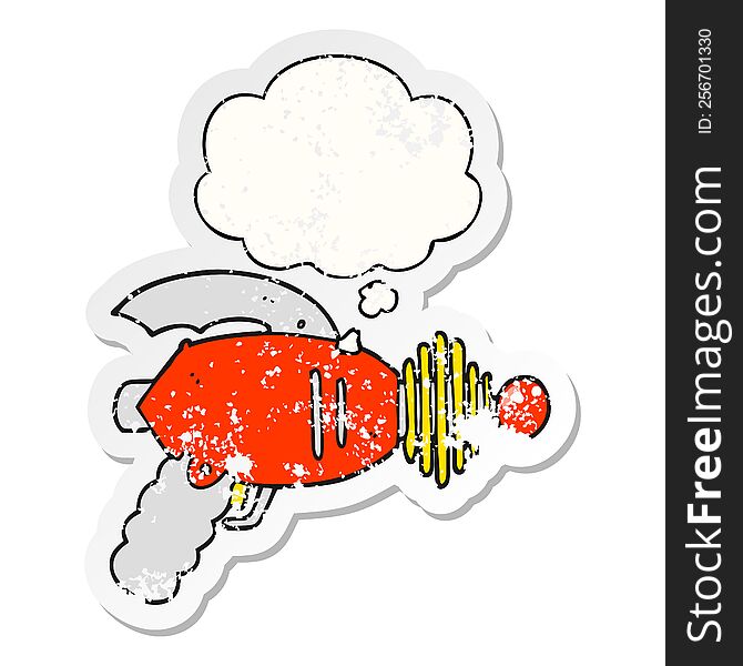 cartoon ray gun with thought bubble as a distressed worn sticker