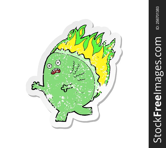 retro distressed sticker of a cartoon monster on fire