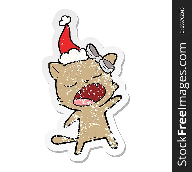 Distressed Sticker Cartoon Of A Singing Cat Wearing Santa Hat