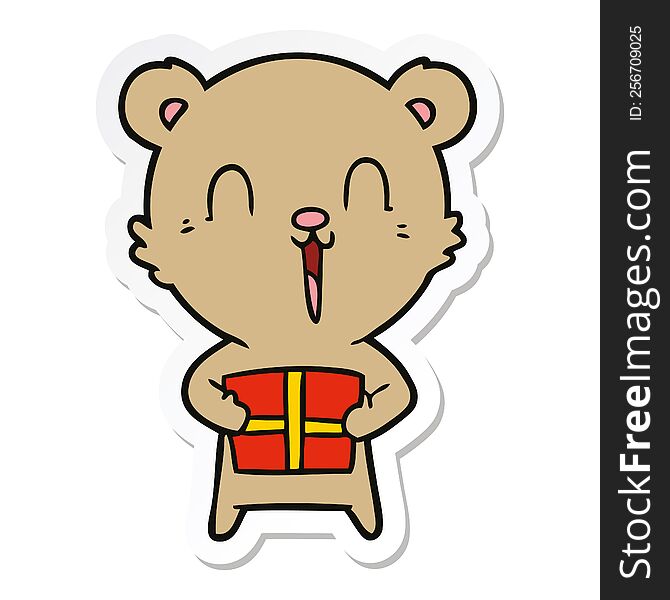 sticker of a happy cartoon bear with christmas gift