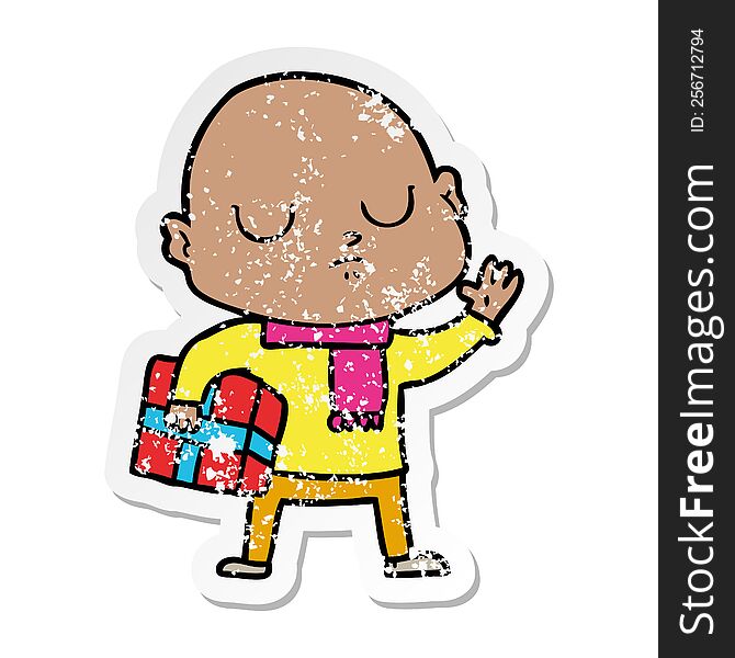 distressed sticker of a cartoon bald man with xmas gift