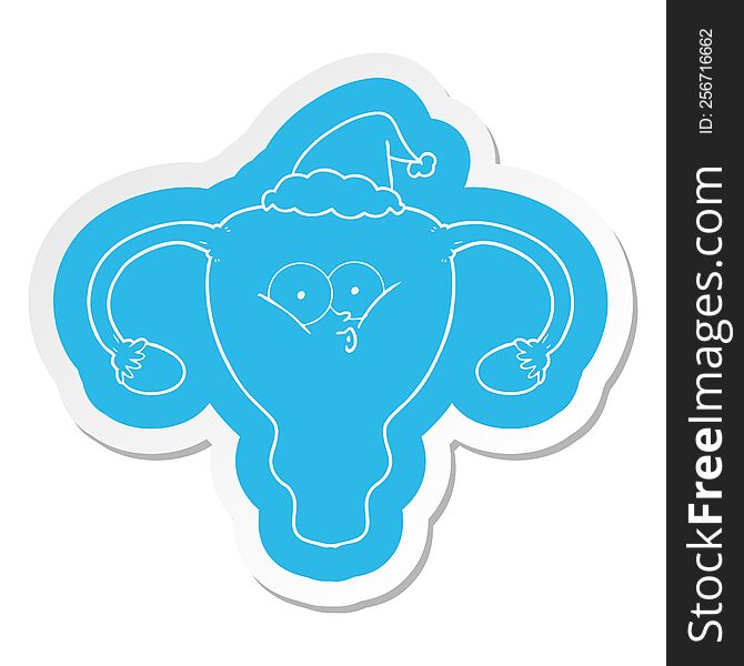 quirky cartoon  sticker of a uterus wearing santa hat