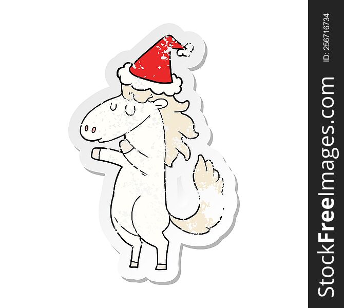 hand drawn distressed sticker cartoon of a horse wearing santa hat