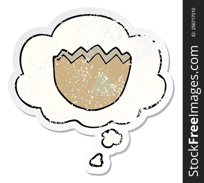 cartoon cracked eggshell with thought bubble as a distressed worn sticker