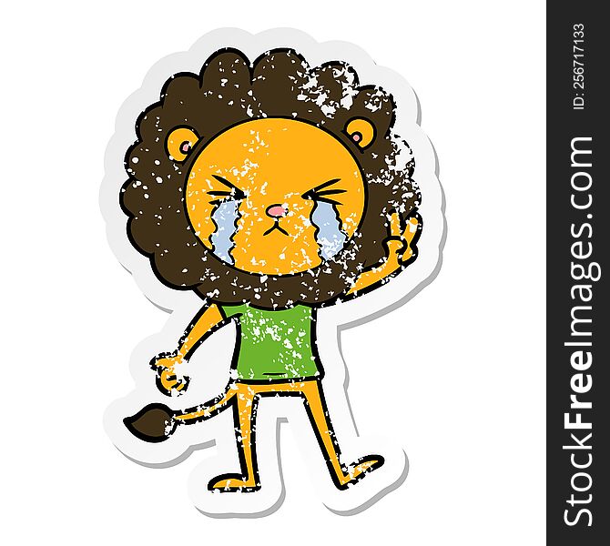 distressed sticker of a cartoon crying lion giving peace sign