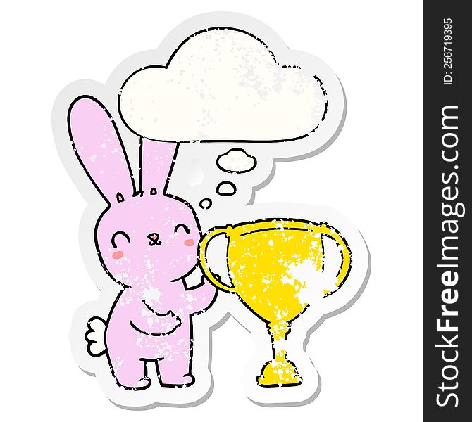 Cute Cartoon Rabbit With Sports Trophy Cup And Thought Bubble As A Distressed Worn Sticker