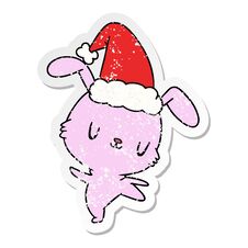 Christmas Distressed Sticker Cartoon Of Kawaii Rabbit Stock Photo
