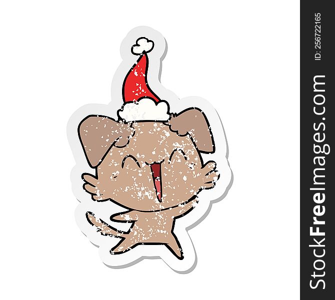 Happy Little Dog Distressed Sticker Cartoon Of A Wearing Santa Hat