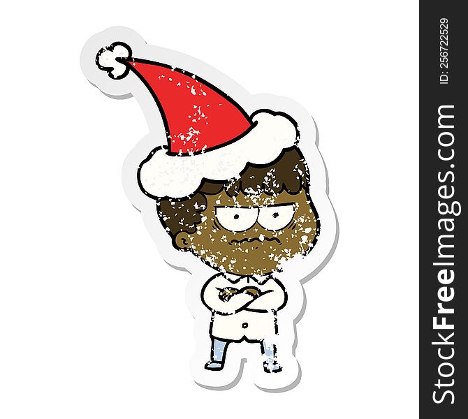 Distressed Sticker Cartoon Of An Annoyed Man Wearing Santa Hat