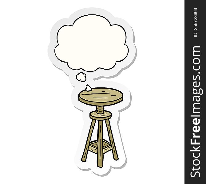 cartoon artist stool with thought bubble as a printed sticker
