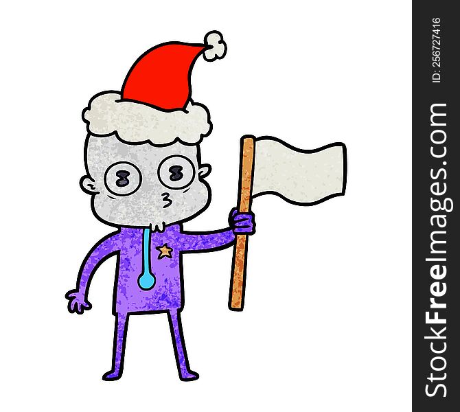 Textured Cartoon Of A Weird Bald Spaceman With Flag Wearing Santa Hat