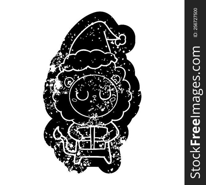 cartoon distressed icon of a lion with christmas present wearing santa hat