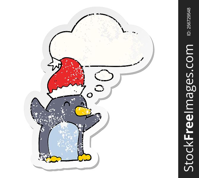 Cute Cartoon Christmas Penguin And Thought Bubble As A Distressed Worn Sticker