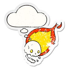 Spooky Cartoon Flaming Skull And Thought Bubble As A Distressed Worn Sticker Royalty Free Stock Image