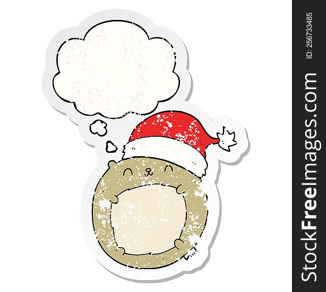 cute cartoon christmas bear with thought bubble as a distressed worn sticker