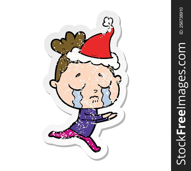 Distressed Sticker Cartoon Of A Crying Woman Wearing Santa Hat