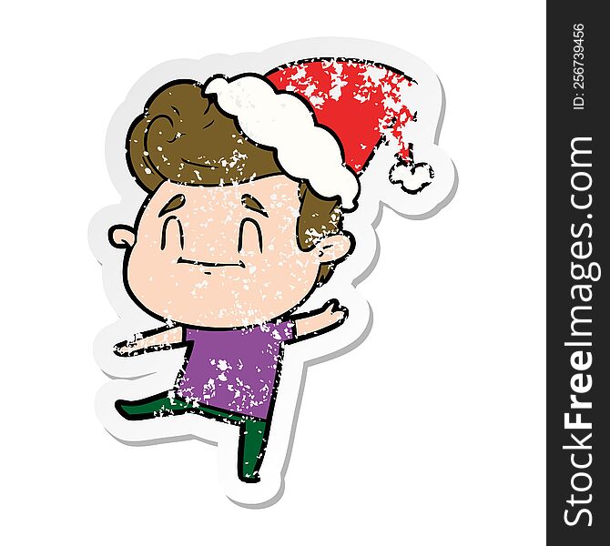 Happy Distressed Sticker Cartoon Of A Man Wearing Santa Hat