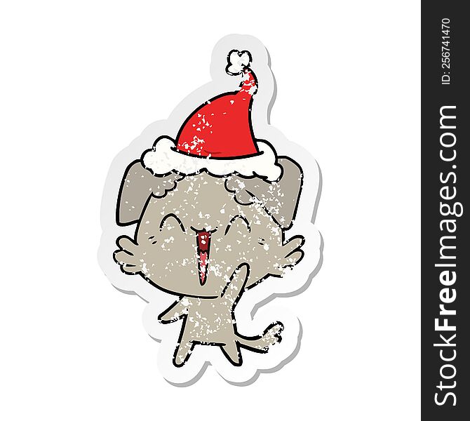 Happy Little Dog Distressed Sticker Cartoon Of A Wearing Santa Hat