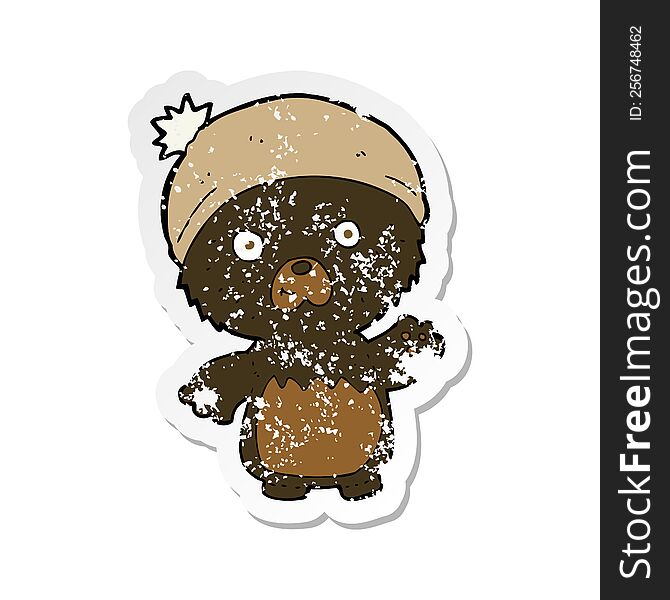 Retro Distressed Sticker Of A Cartoon Cute Teddy Bear In Hat