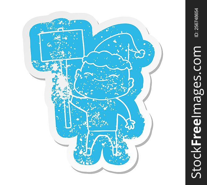 Happy Cartoon Distressed Sticker Of A Bald Man Wearing Santa Hat