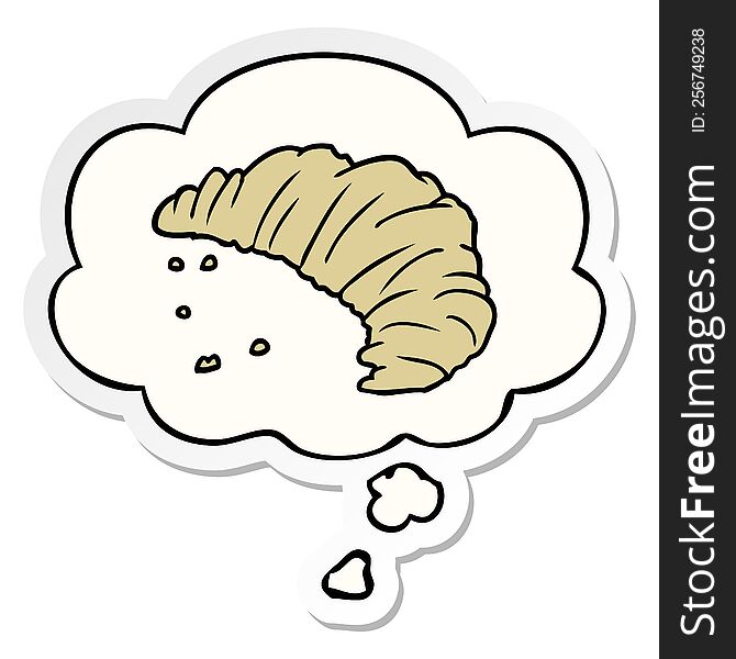 cartoon croissant with thought bubble as a printed sticker