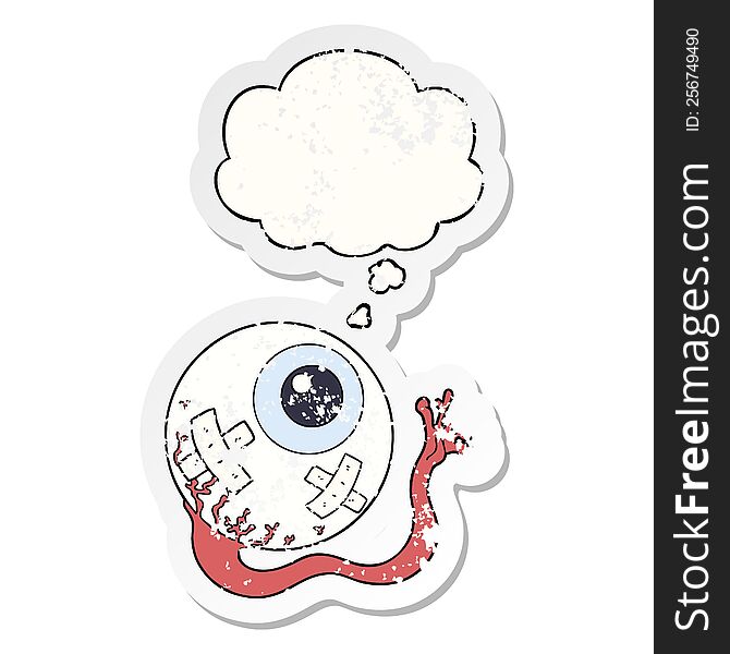 cartoon injured eyeball with thought bubble as a distressed worn sticker