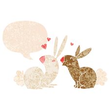 Cartoon Rabbits In Love And Speech Bubble In Retro Textured Style Royalty Free Stock Images