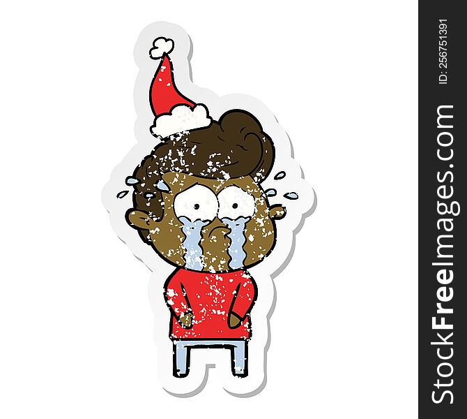 Distressed Sticker Cartoon Of A Crying Man Wearing Santa Hat