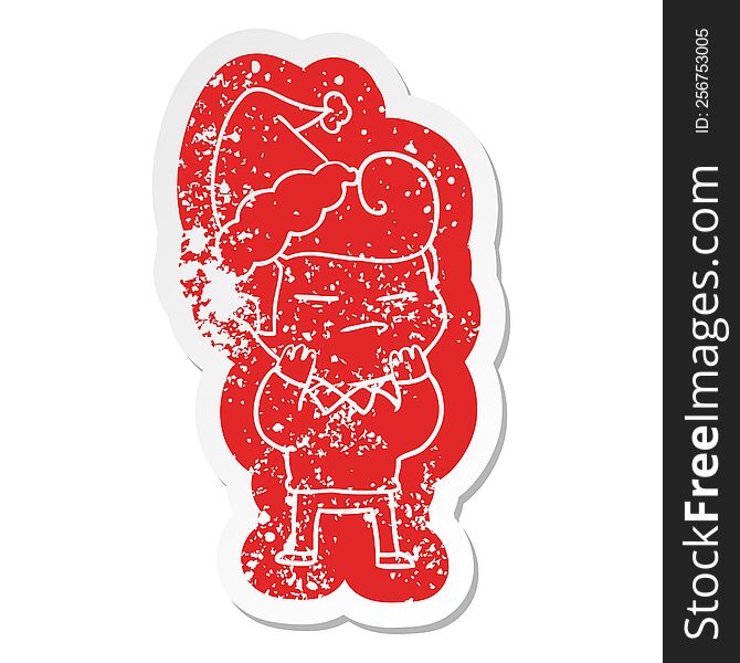 Cartoon Distressed Sticker Of A Cool Guy With Fashion Hair Cut Wearing Santa Hat