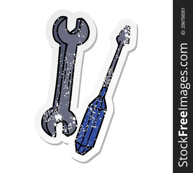 hand drawn distressed sticker cartoon doodle of a spanner and a screwdriver