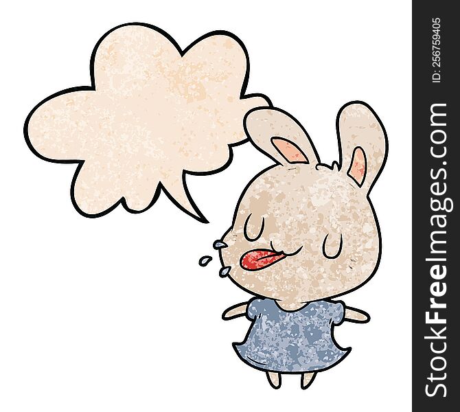 cute cartoon rabbit blowing raspberry and speech bubble in retro texture style