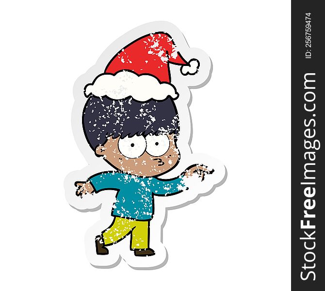 Nervous Distressed Sticker Cartoon Of A Boy Wearing Santa Hat