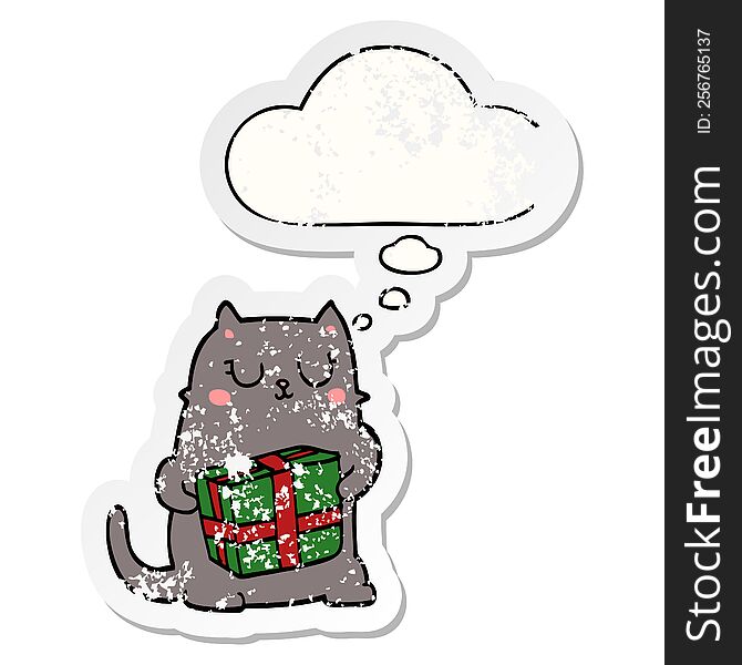 cartoon christmas cat with thought bubble as a distressed worn sticker