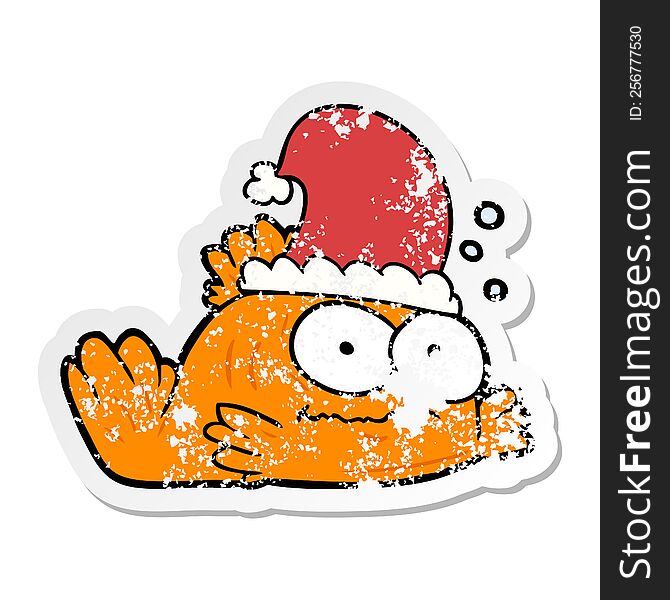 distressed sticker of a cartoon goldfish wearing xmas hat