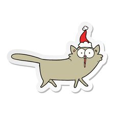 Sticker Cartoon Of A Cat Wearing Santa Hat Stock Photo
