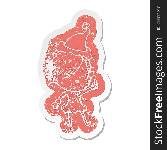 quirky cartoon distressed sticker of a squinting girl wearing santa hat