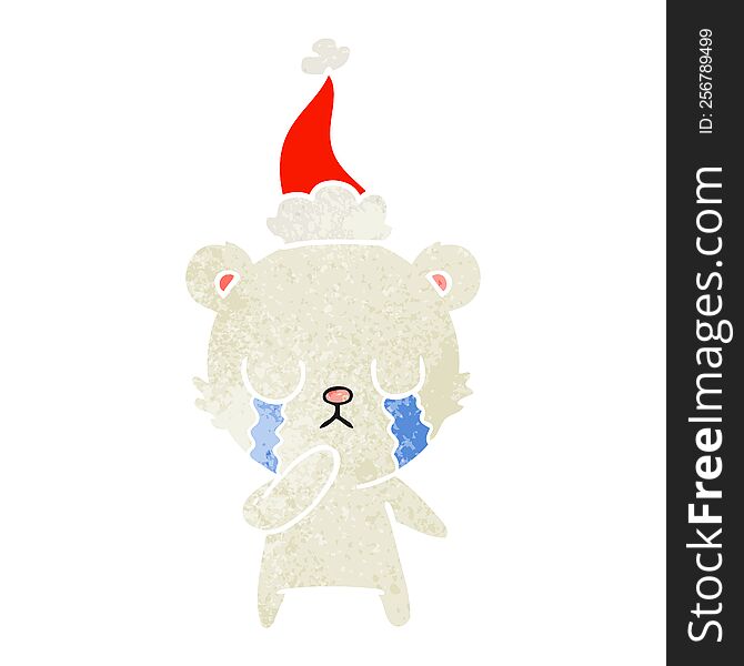 crying polar bear hand drawn retro cartoon of a wearing santa hat. crying polar bear hand drawn retro cartoon of a wearing santa hat