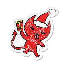 Christmas Distressed Sticker Cartoon Of Kawaii Devil Stock Photo