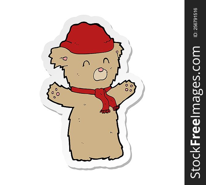 sticker of a cartooon teddy bear in hat and scarf