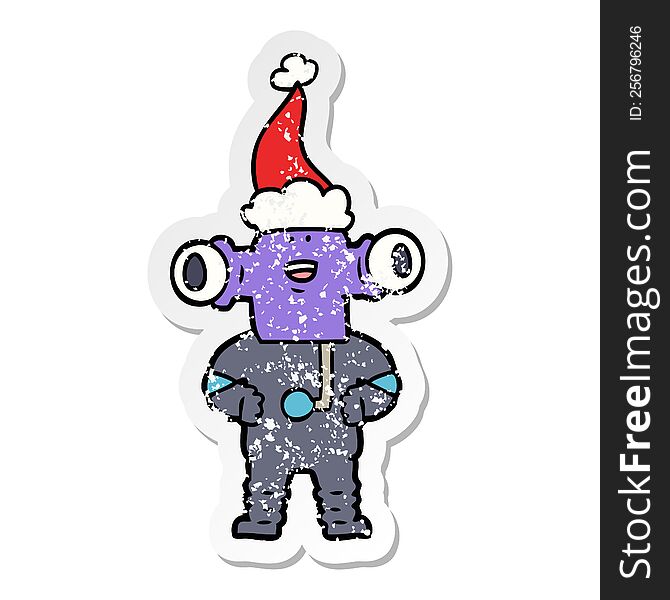 Friendly Distressed Sticker Cartoon Of A Alien Wearing Santa Hat