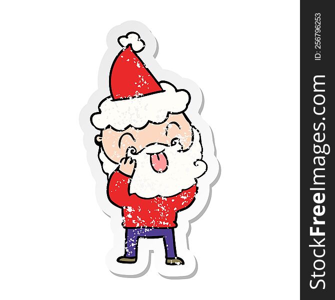 man with beard sticking out tongue wearing santa hat
