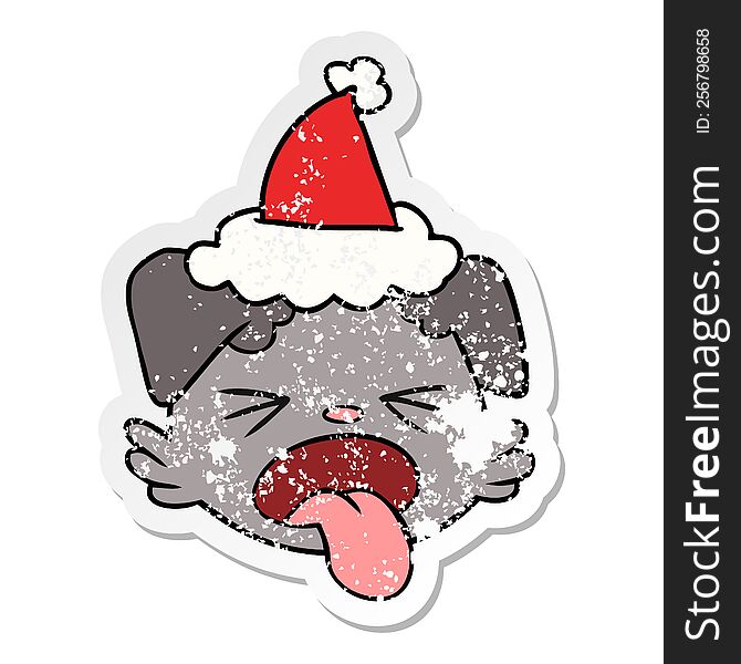 hand drawn distressed sticker cartoon of a dog face wearing santa hat