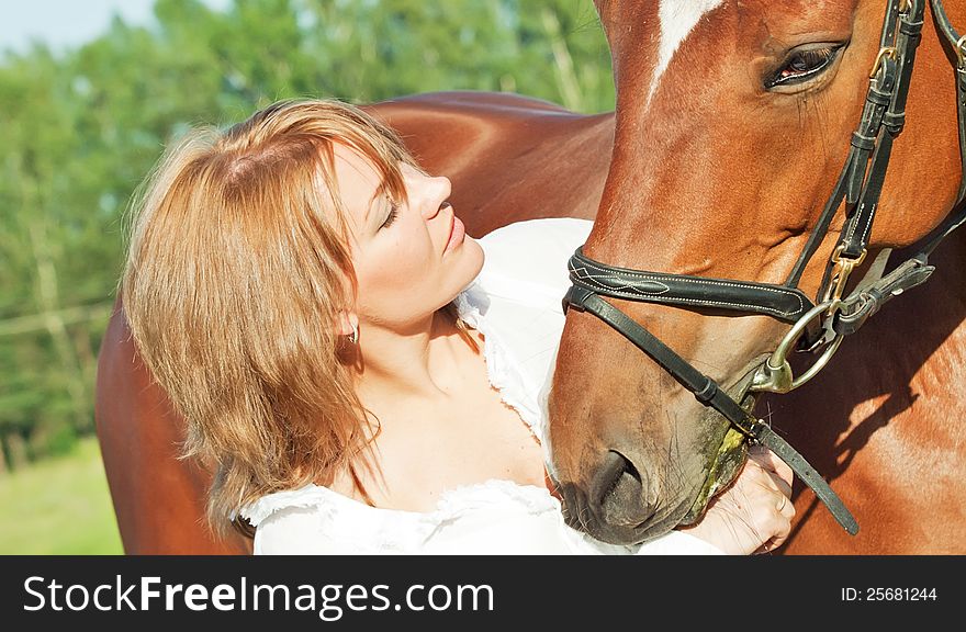 Portaits of cute girl  with her horse close up