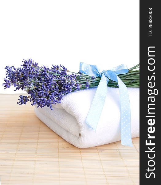 Lavender bunch with blue ribbon  and white towel. Lavender bunch with blue ribbon  and white towel