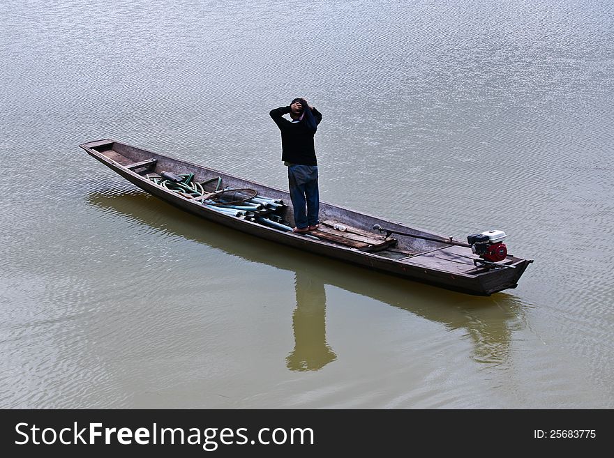 Thai fishermen were fishing in a boat. Thai fishermen were fishing in a boat