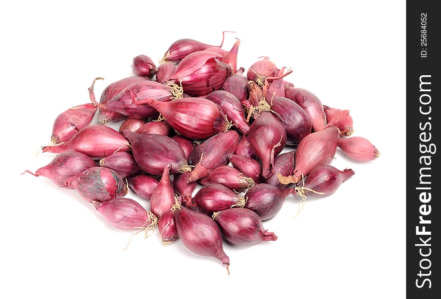 A pile of red onion set on a white background