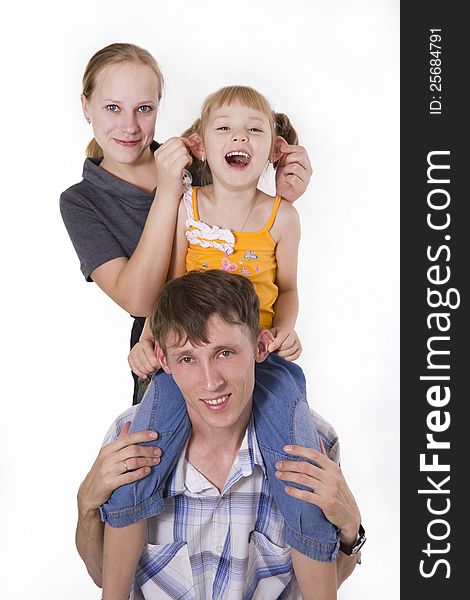 Young European family from three persons - mother, father and daughter. Isolated. Young European family from three persons - mother, father and daughter. Isolated