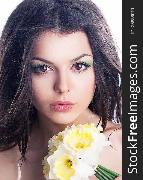 Beautiful girl face with spring flower - daffodil narcissus. Beautiful girl face with spring flower - daffodil narcissus