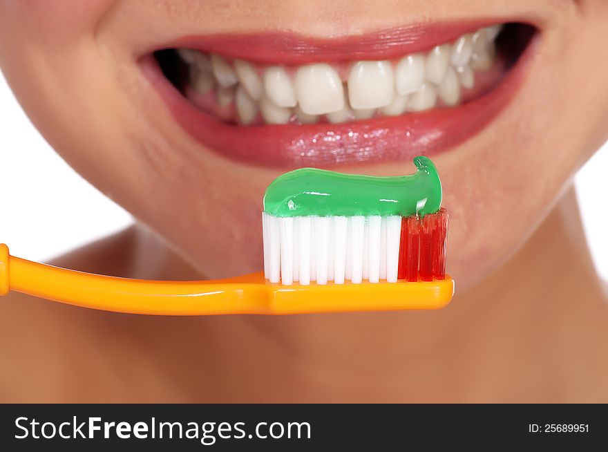 Smiling young woman with healthy teeth holding a tooth-brush. Smiling young woman with healthy teeth holding a tooth-brush